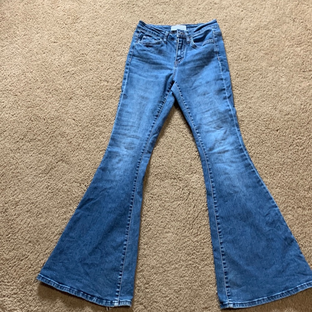 no stains or rips, hem line has mark  & back pocket .  Comfortable bell jeans.